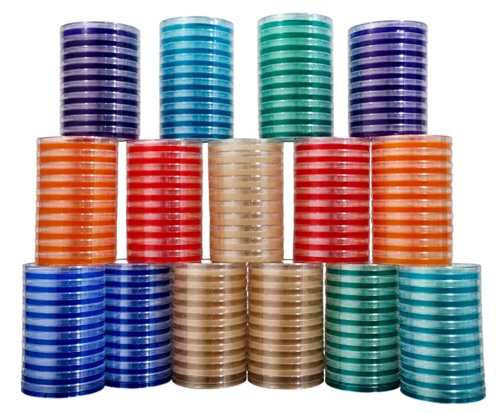 Towers of pre-poured agar plates in purple, blue, green, orange, red and amber